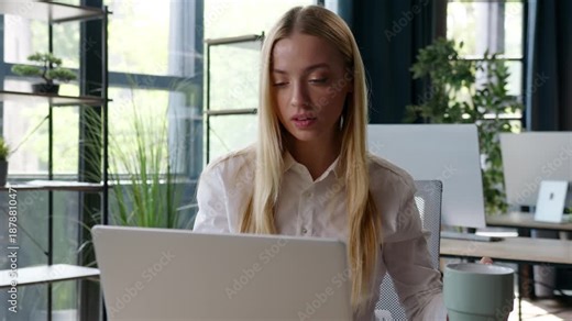 Caucasian business woman working with laptop drinking hot tea coffe holding drink cup at table businesswoman relaxing stretching after typing computer work project female girl stretch pause in office