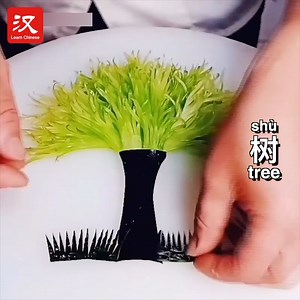 444K views · 2.1K reactions | Celery, eggplant, cucumber, and red pepper have transformed into a "fortune tree（树 shù）" under the careful carving of this young chef. | Learn Chinese | Facebook