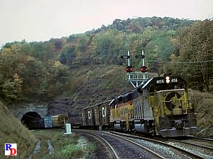 An eastbound Chessie System train emerges from Sand Patch Tunnel and begins the descent down the east slope of Sand Patch Grade. From the JPM show "Chessie Sand Patch, Volume Two" https://rfd.video/Chessie2 | Railfan Depot