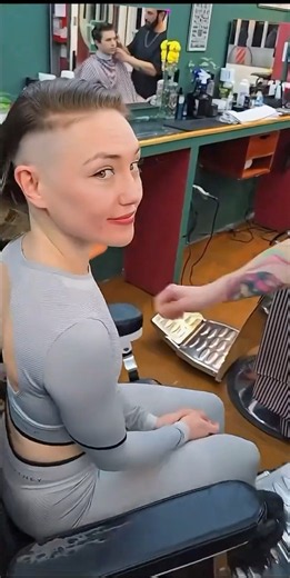 Girl gets a side shave haircut with clippers in a Barbershop 💈