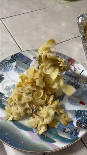 Tuna casserole with potato chips and cheese sauce