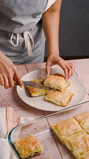 Reimagine roast chicken leftovers with our scrumptious Kotopita recipe. Fill up on chicken, feta, fresh leeks, green onions and kefalotyri cheese all wrapped up in a blanket of phyllo. Recipe link in bio. | Athens Foods