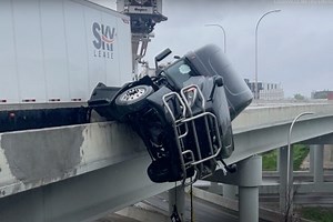 Driver Rescued From Bridge