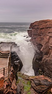 Thunder Hole, in Acadia National Park in Maine, began as a fissure in Mount Desert Island’s granite cliffs. Over 15,000 years of post-glacial isostatic rebound, the land rising after Ice Age glacier retreat, positioned this crevice perfectly to interact with tidal forces. The result is that the narrow passage functions as a blowhole. During the right conditions, waves funnel into a 10-foot-wide channel, compressing air in an underwater cavern until pressure releases explosively through a surface