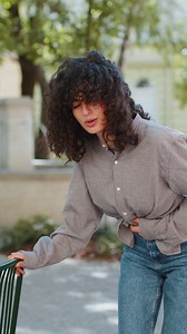 Woman tourist feeling sudden strong abdominal stomach ache diarrhea gastritis problem on city street | Premium Stock Video Footage