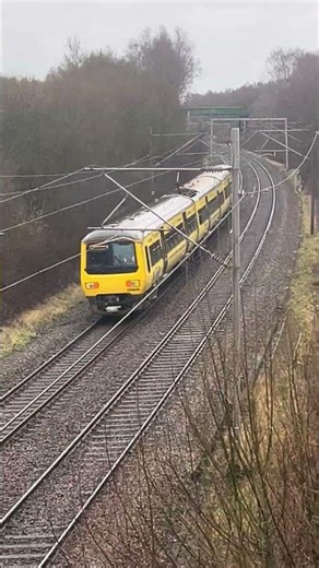 (New livery?!) Northern class 323 Bee Network livery passing under a footbridge near Macclesfield