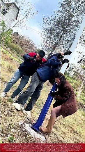 Teamwork Installing a Solar Light Pole on a Pre-Cast Base