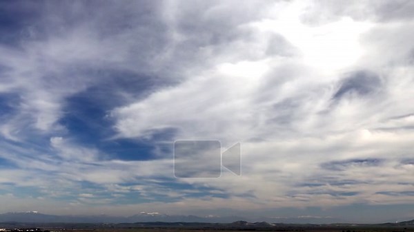 Timelapse storm clouds and cirrus drift across blue sky, revealing fast changing weather. Accelerated cloudbank flow shows swirling vapor layers, shifting light, unstable atmosphere, moody heavens. cumulus, moody sky, crop field, cloud layers Stock Video Footage - Alamy