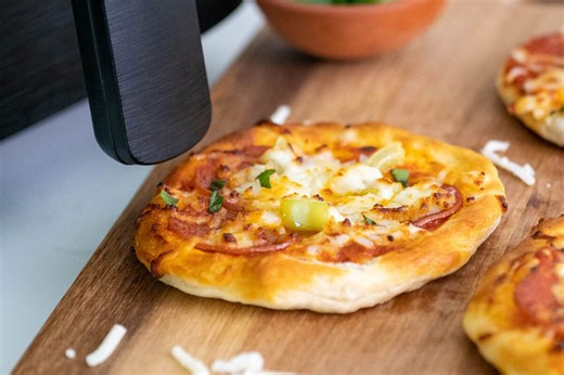 These air fryer mini pizzas start with biscuit dough (so easy it’s dangerous)