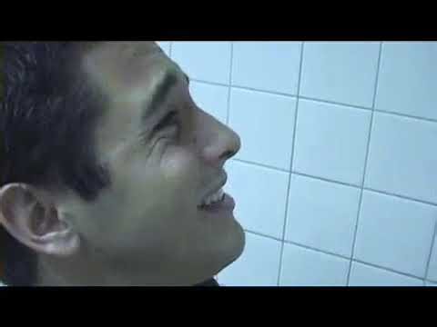 2 boys in the same restroom and one of them is taking a dump