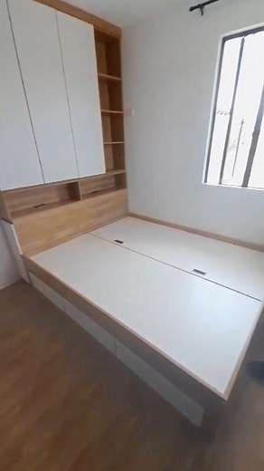 Introducing the Andrew Bed Frame: a sophisticated design featuring drawers and hidden storage, complemented by a headboard with cabinets. Finished in a stylish two-tone combination of white and wood laminates, this bed frame seamlessly blends functionality with modern elegance. | Persquare