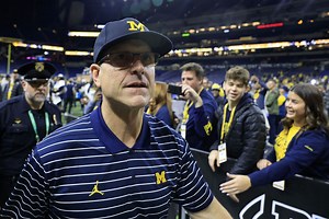 What is Jim Harbaugh's record against Ohio State?