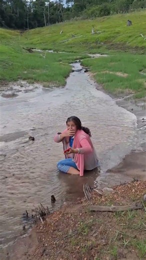 Woman Misjudges Muddy Stream Depth and Gets Foot Stuck
