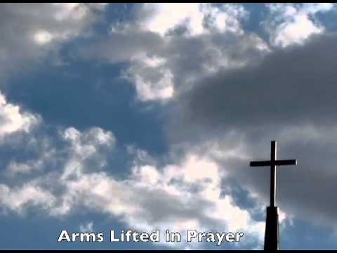 Jesus Face in the Clouds Praying by a Cross