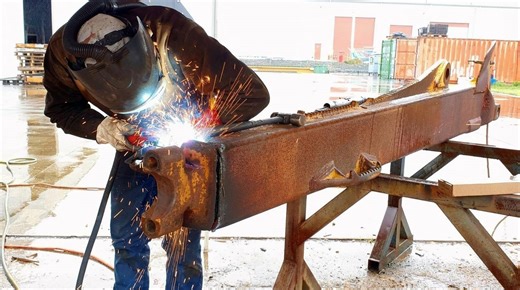 Gouging and welding repairs on a D8 dozer push arm