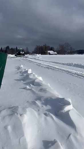 John Deere Tractor Clearing Snow in Rural Area