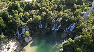 Kravica Waterfalls, located in Bosnia and Herzegovina, is one of the country's most popular tourist attractions. People come here to take photos, camp, picnic, and swim. Stock Video