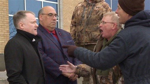 Fisheries minister faces angry crab harvesters on steps of Confederation Building