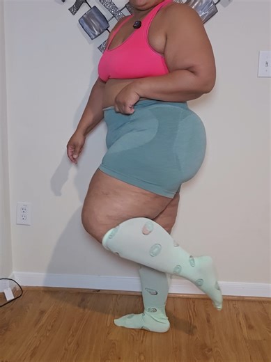 Compression Socks, they are wide calf friendly and they don't roll down on me. The material is breathable and skin friendly.