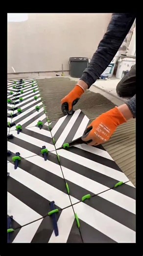 Real Engineerings | Engineering & Technology & Gadgets & DIY on Instagram: "Geometric Perfection: The Art of Precision Tiling! 📐✨ ​Watch how a mesmerizing optical illusion comes to life! This is high-end floor tiling, where mathematical precision meets artistic design to transform a simple room into a visual masterpiece. ​The Mechanics of a Flawless Floor ​This process relies on modern leveling technology to ensure a perfectly flat surface, crucial for large-format or patterned tiles: ​The Setu
