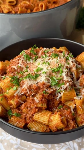 Pasta Bolognese 🍝🍅🧄 — Ingredients — 🌿 3 celery stalks 🥕 4 carrots 🧅 1 large onion 🧄 6 garlic cloves 🛢 2 tbsp extra virgin olive oil 🧈 2 tbsp butter 🧂 1/2 tsp salt ⚫️ 1/2 tsp black pepper 🥫 1 × 6oz can tomato paste 🥩 2 lbs ground beef chuck 🍗 2 cups chicken stock 🍅 28 oz can crushed tomatoes 🌿 1 tbsp oregano 🌶 1 tsp chili flakes (to taste) 🧂 1/2 tbsp salt ⚫️ 1/2 tsp black pepper 🥛 1 cup heavy cream 🧀 1/2 cup Parmesan cheese 🍝 1 lb Mezzi Rigatoni (boiled) — Garnish — 🧀 Parmesa