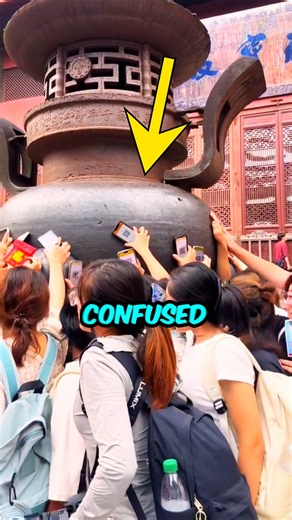 EMSRY Facts on Instagram: "You Have Been Praying Wrong Your Whole Life! 🙏❌ (Watch) Are you still working hard for money? 💸🛑 You might be doing it all wrong! These people in China aren't trying to melt their phones; they are hacking the system of prayer! Instead of bringing wallets, they wave their Payment QR Codes over the holy incense smoke. 📲💨 Why? To ask the gods to bypass cash and deposit wealth DIRECTLY into their bank accounts! Is this a genius financial strategy or just crazy superst