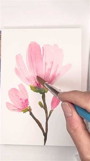 Artist/ teacher/ illustrator on Instagram: "Want to paint a super EASY watercolor floral card? Check out my latest YouTube tutorial on how to do just that! I give you lots of easy tips & tricks to paint beautiful floral cards- just in time for Mother’s Day! Click the link in my profile to learn! Happy Painting! 🖼️ . . . . . . . #watercolor #watercolorpainting #reel #watercolorartist #artoftheday #magnolia #flowers"
