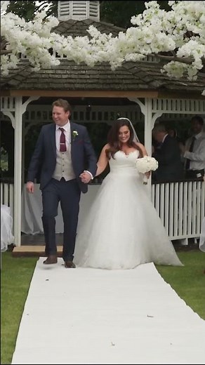 bride and groom walk up the aisle