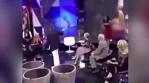 Woman leaves set after presenter pulls down her top on TV