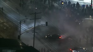 Fireworks launched at LAPD officers as Dodgers fans poured into Los Angeles streets