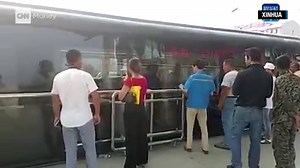 The Transit Elevated Bus had its inaugural test drive in Qinhuangdao, China. The bus can hold 300 people while driving over cars on the road and aims to alleviate China's overcrowding problem. http://cnnmon.ie/2amDknp Via CNNTech | CNN Business