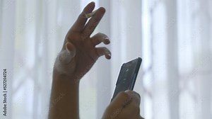 Man Smoking Cigarette Using While Using A Mobile Phone