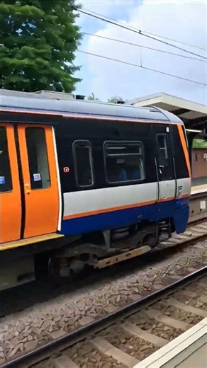 London overground class 378 departs at Brondsbury park