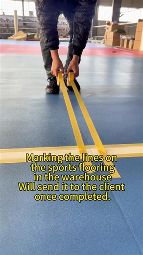Marking the lines on the sports flooring in the warehouse. Will send it to the client once completed ·#BadmintonCourtFlooring # BadmintonFloor # SportsVinyl Flooring #PVC Sports Flooring # Badminton-Specific Flooring