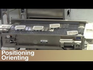 Frozen Dinners Transferring Through a Lane Switch Conveyor System