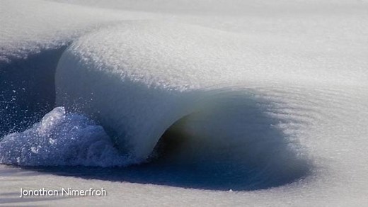 Surfers brave waves of 'slush' caused by sub-zero temps