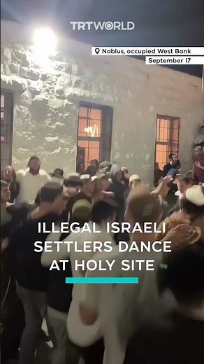 Israeli settlers dance at holy site in occupied West Bank