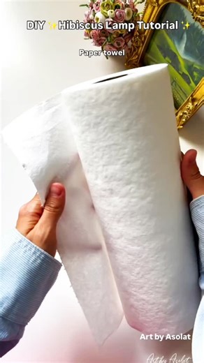 Crafted By Ayesha on Instagram: "Turn simple supplies into a glowing hibiscus dream ✨ Handmade beauty that lights up the room 🌸 DIY Hibiscus Lamp = pure creative magic 💡 #diylamp #hibiscusflower #homedecorideas"