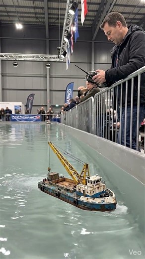 Massive Crane Barge Lifting Giants at Naval Expo #CraneBarge #NavalExpo #HeavyMachinery #Ships