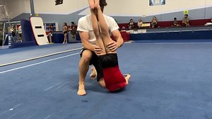 October 16, 2019 Coach wade going over the back extension roll blind pirouette during line drill warmup. | Gymnastics World