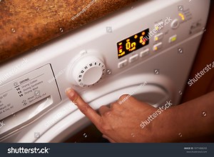 Woman Operating Washing Machine Home Stock Photo 1977408293 | Shutterstock