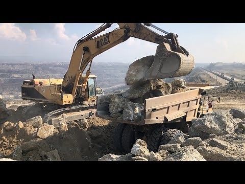 Caterpillar 375 LME Excavator Loading Rocks On Caterpillar Dumpers - Sotiriadis\\Labrianidis Mining