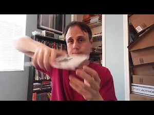 How to get a CD booklet out of the case quickly, easily, and without damaging it.