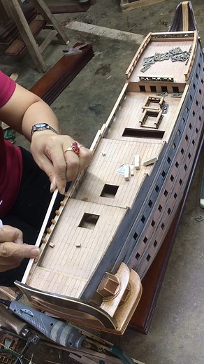 Adding Finishing details to HMS Victory ⚓️✨" Available at: https://omhusa.com/catalog/t032-hms-victory-xl-war-ship-model #HMSVictoryReplica #Craftsmanship #ModelShip #craft #art #modelboat #modelshipbuilding #craft #modelship #woodword #modelboatbuilding #modelboatbuilder #handmade #handcraftedship #HMSVictorymodelship #HMSVictoryship #HMSVictory #hugemodelship | Ship Model