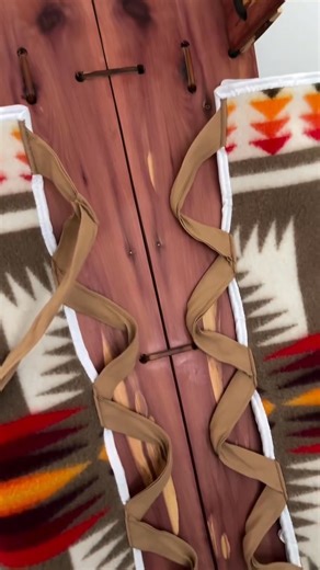 This is a Navajo cradleboard, something I’ve used with my baby since she was a newborn. She’s 6 months now and still sleeps in it every day—naps and bedtime. It’s been a huge help for us because she sleeps longer and more peacefully, without rolling around or waking herself up. In Indigenous families, cradleboards are a traditional baby carrier and sleep tool. They’re made to support the baby’s posture and help them feel secure, kind of like being swaddled. The firm board behind them is usually