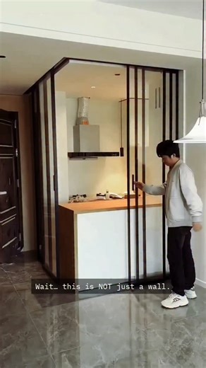 Aluminium and Glass Work on Instagram: "This kitchen disappears in seconds 😲 Smart glass partition = clean, modern, and mess-free living. Would you install this? 👇 #ModernKitchen #GlassPartition #HomeDesignIdeas #SmartHomes #InteriorDesign"