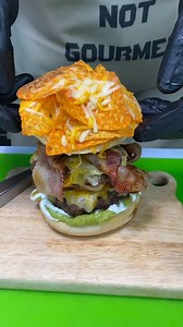 NACHO BURGER 🍔🧀🥓 Ground Beef Mexican Cheese Bacon Doritos Guacamole Sour Cream Hamburger Buns Create two patties and fry, alongside bacon. Add cheese to burgers, add lid to pan and cover until cheese is melted. Toast buns in oven. Add guacamole and sour cream to bottom bun, place burgers on top, then add bacon. Invert upper bun and add doritos and more cheese. Broil until melted and place on top of burger. Add guacamole and sour cream. Enjoy! | Definitely Not Gourmet