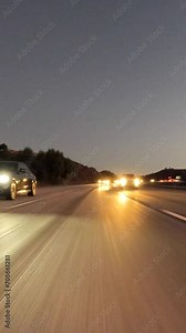 Vertical night rear view driving time lapse view of Route 23 and Route 118 freeways in the Thousand Oaks and Moorpark areas of Ventura County, California.