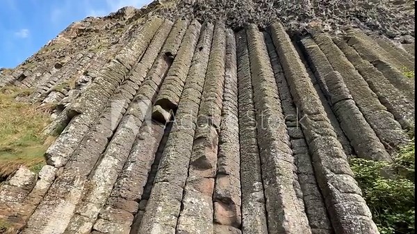 The Giant's Causeway, a UNESCO World Heritage Site on Northern Ireland's Antrim Coast, features 40,000 interlocking basalt columns formed by volcanic activity. Its hexagonal stones and coastal beauty