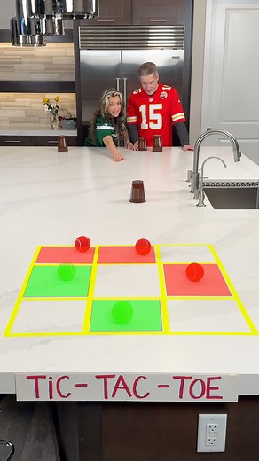Tic Tac Toe: Football edition 🏈 Getti and Mike slide football themed party cups with tennis balls to see who will win the tic tac toe challenge. Great DIY idea for a game for gatherings and parties. #football #coupleschallenge #fblifestyle #challenges #diygames | The Tus House